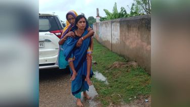 Cyclone Dana: ASHA Worker In Odisha Carries Elderly Woman On Her Back To Cyclone Shelter, Hailed