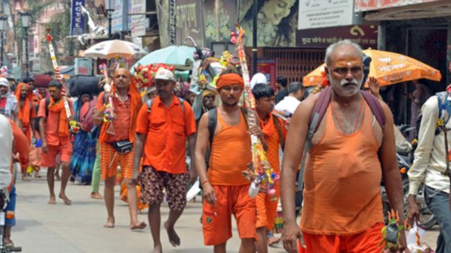 UP govt bans display of arms during Kanwar Yatra