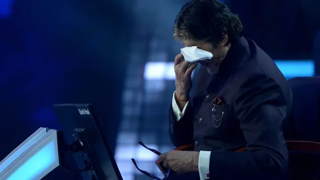 A hug from Abhishek Bachchan leaves Amitabh Bachchan teary-eyed on KBC 14