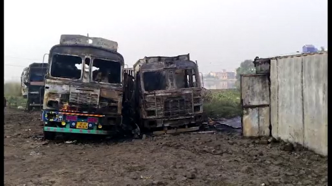 Two 12-wheeler trucks with containers got burnt