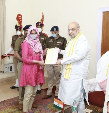 Shah hands over appointment letters to the kin of the martyred J&K cops