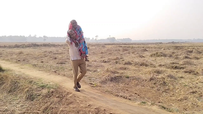 Son Carries Mother For 5 Km On Shoulder For Darshan In Balasore