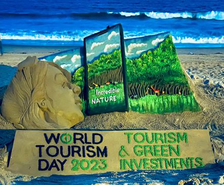 Beautiful message in sand art on Tourism Day-by-sant-artist-sudarshan-pattnaik
